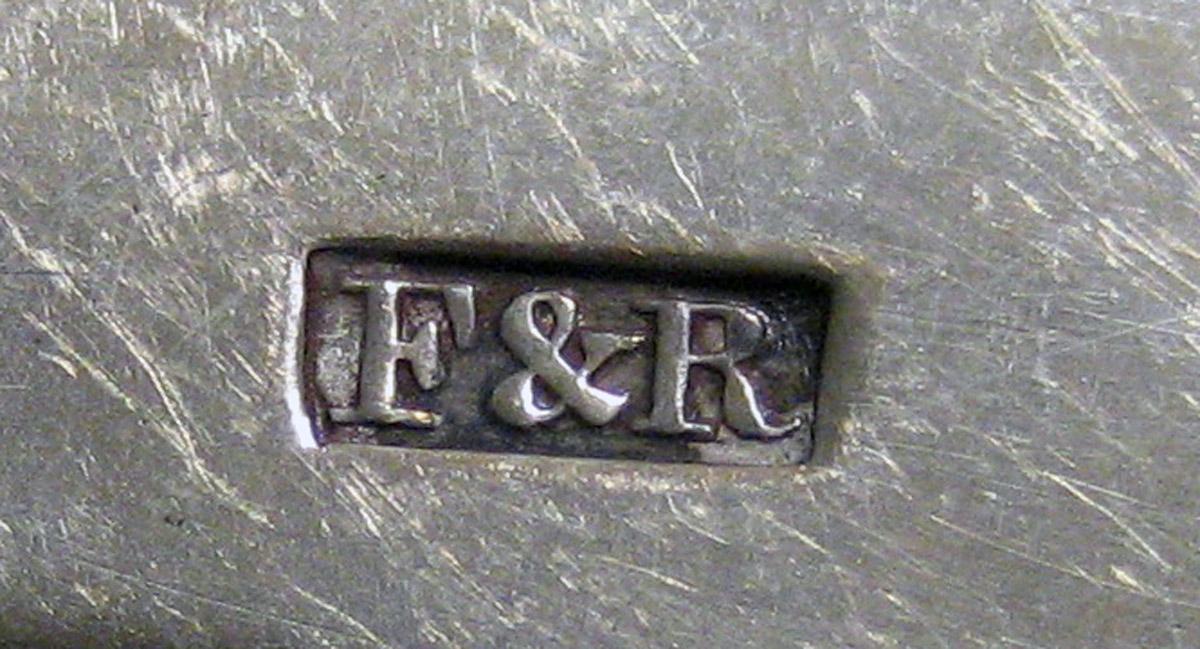 1970.0155 Teaspoon mark