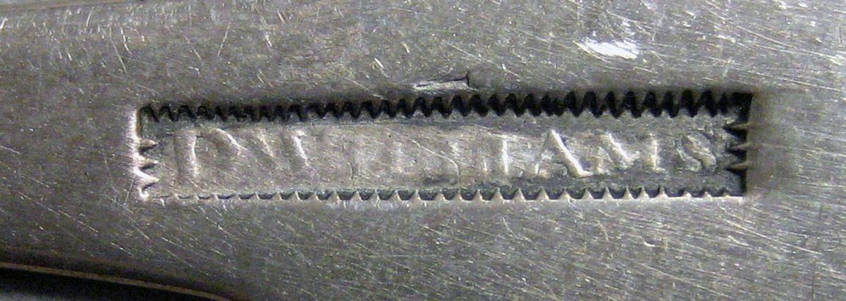 1970.0165 Teaspoon mark