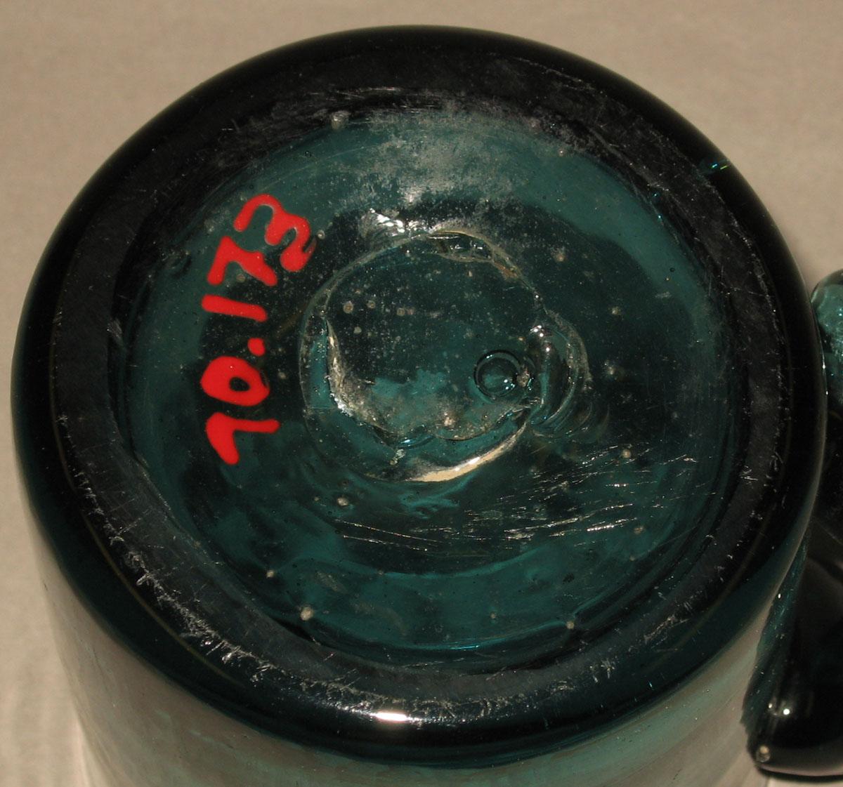 1970.0173 Glass mug (underside)