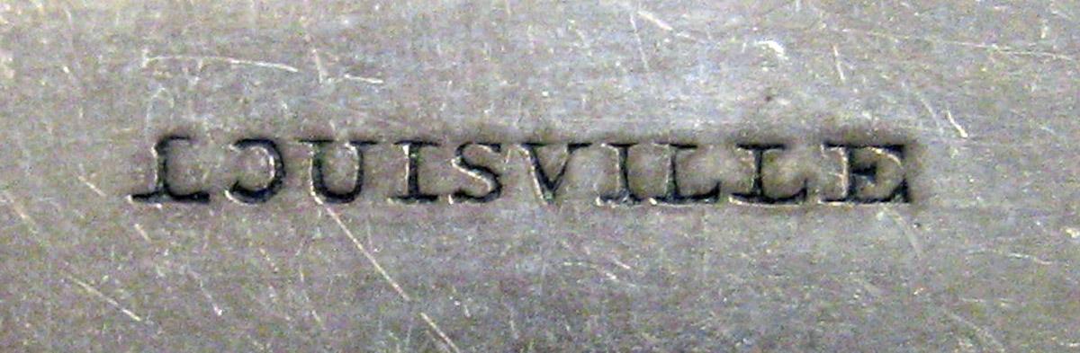 1970.0185 Teaspoon mark