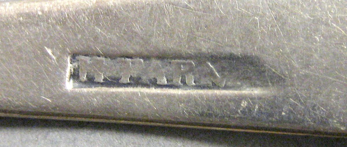 1970.0243 Teaspoon mark