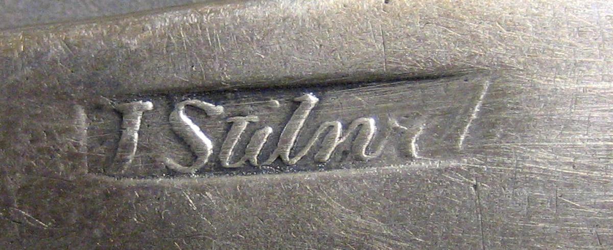 1970.0244 Teaspoon mark