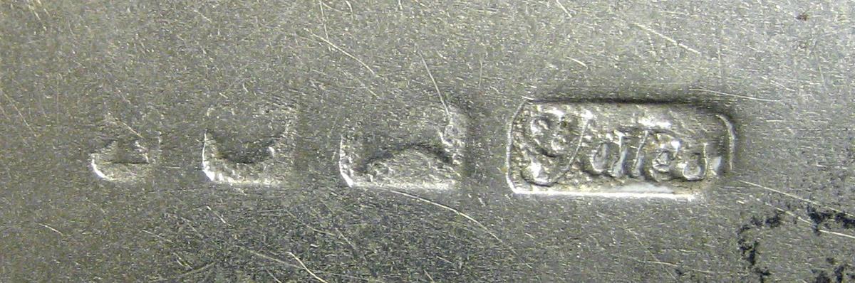 1970.0259 Teaspoon mark