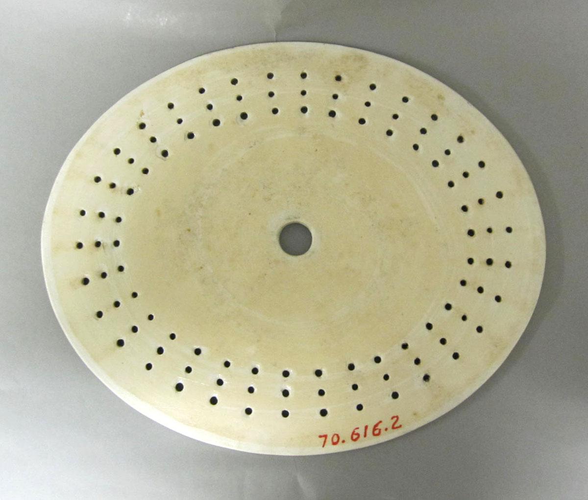 1970.0616.002 Porcelain strainer underside