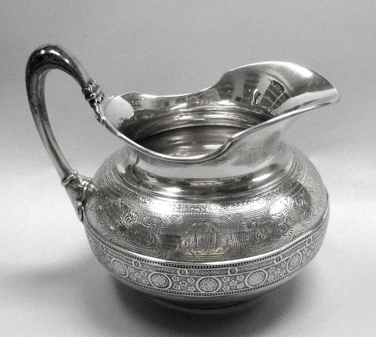 1970.1039.008 Cream pot, side 1