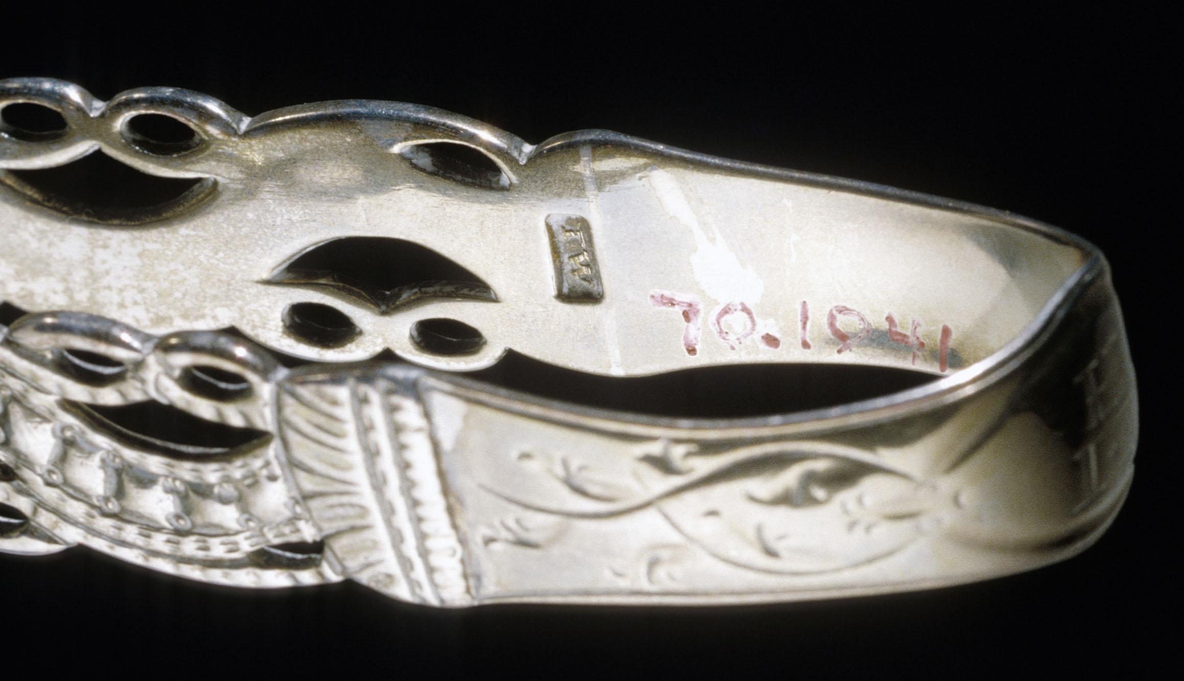1970.1041 Sugar Tongs, detail 1