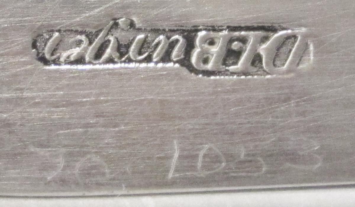 1970.1053 Tongs, inscription