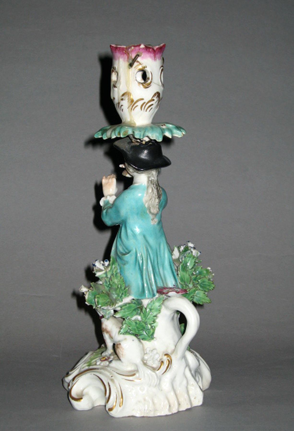 1970.1372.001 Porcelain candlestick figure (reverse)