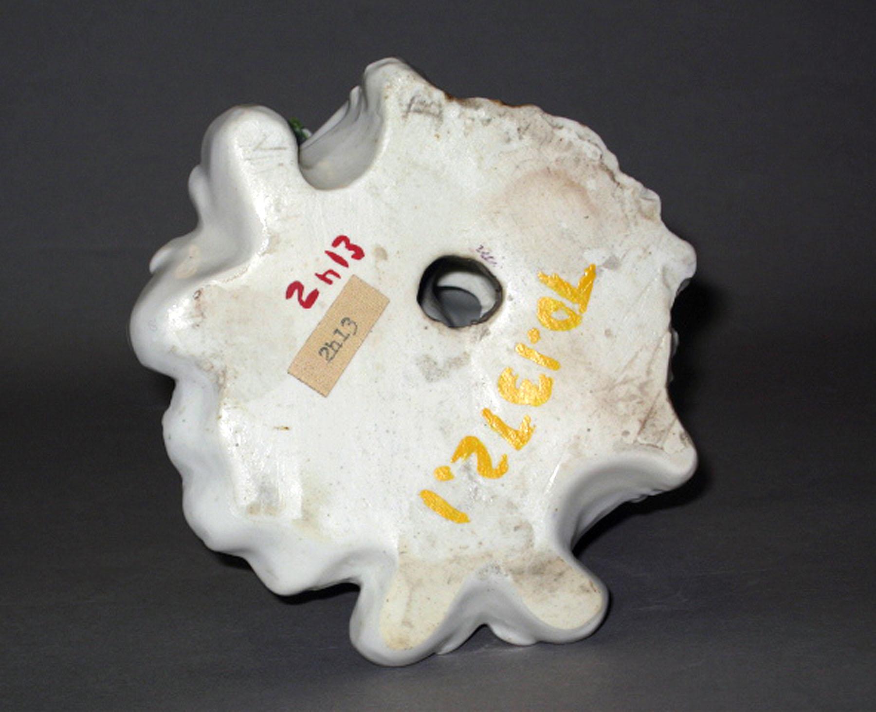 1970.1372.001 Porcelain candlestick figure (underside)