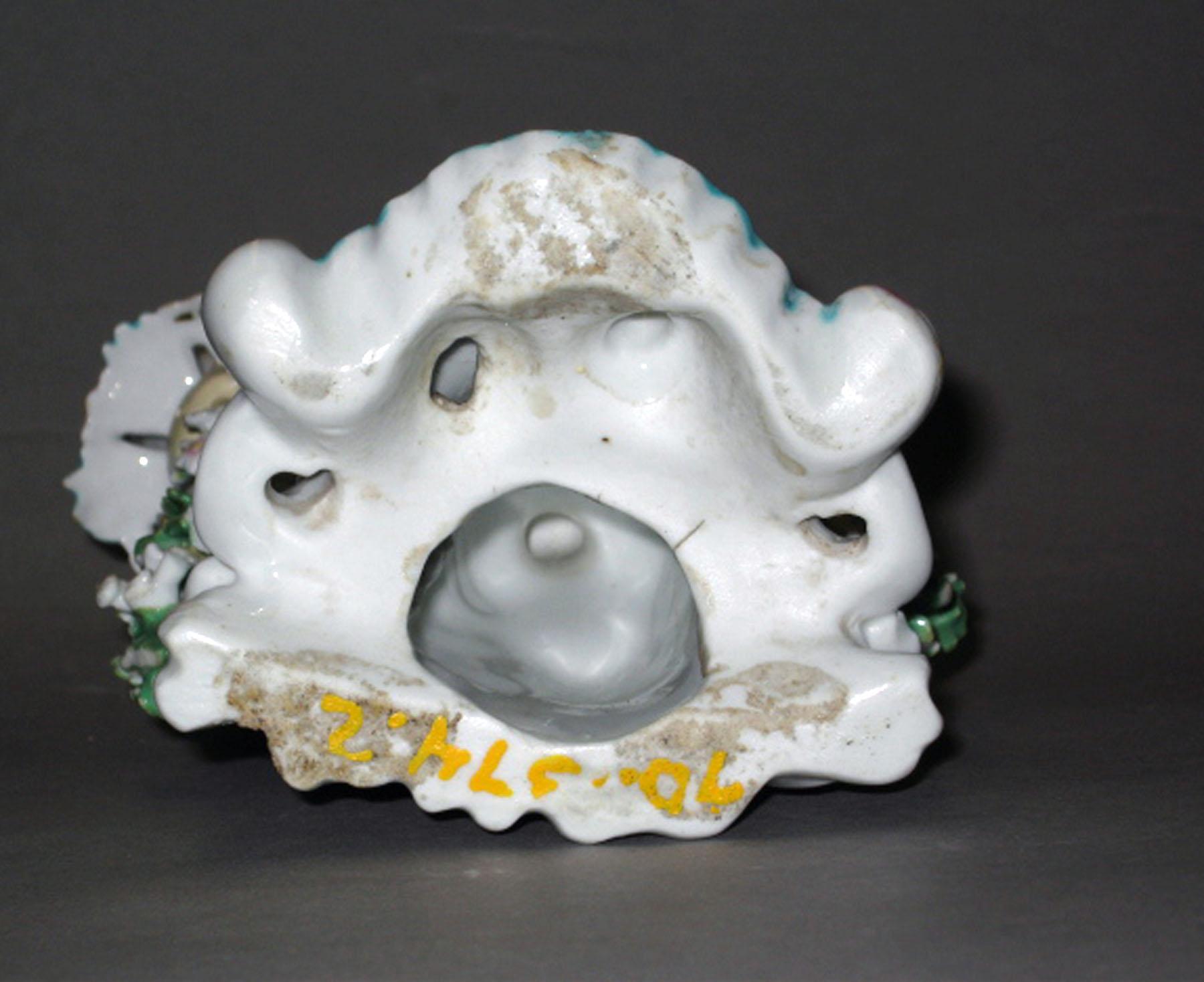 1970.1374.002 Porcelain candlestick figure (underside)