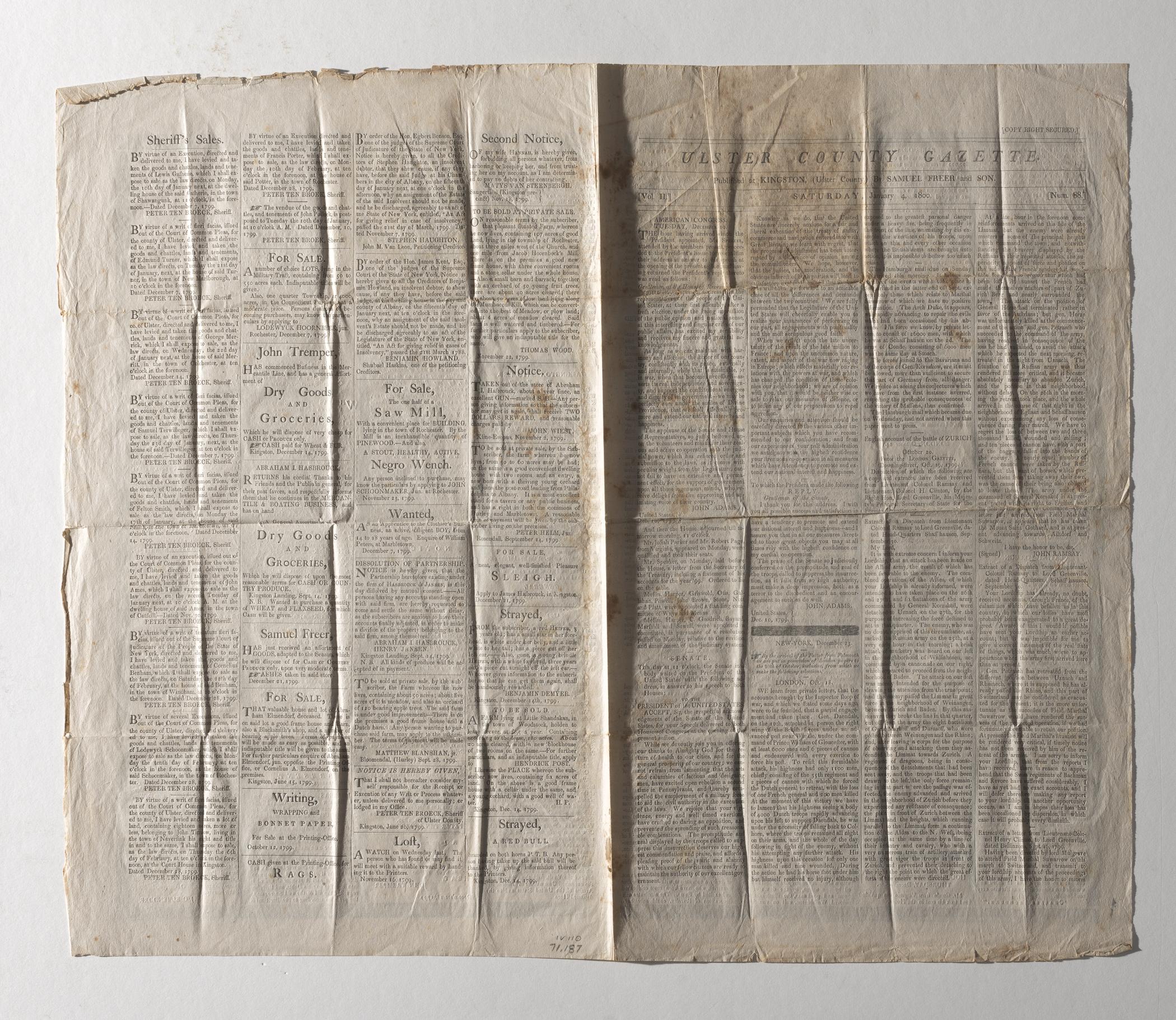 1971.0187 Newspaper, page 4, page 1, view 2, raking light