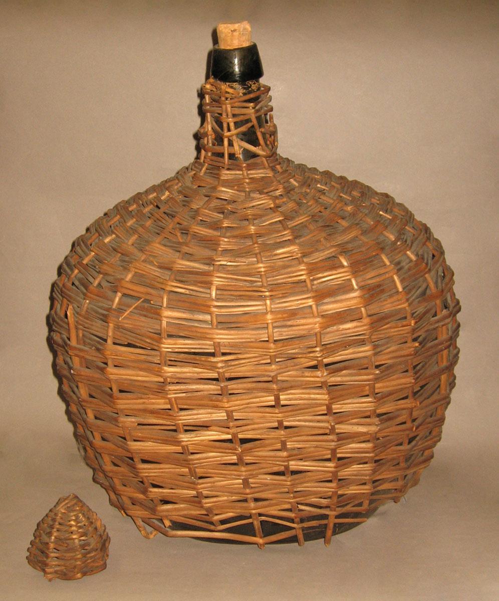 1971.0199 A- C Glass bottle in wicker case (carboy)