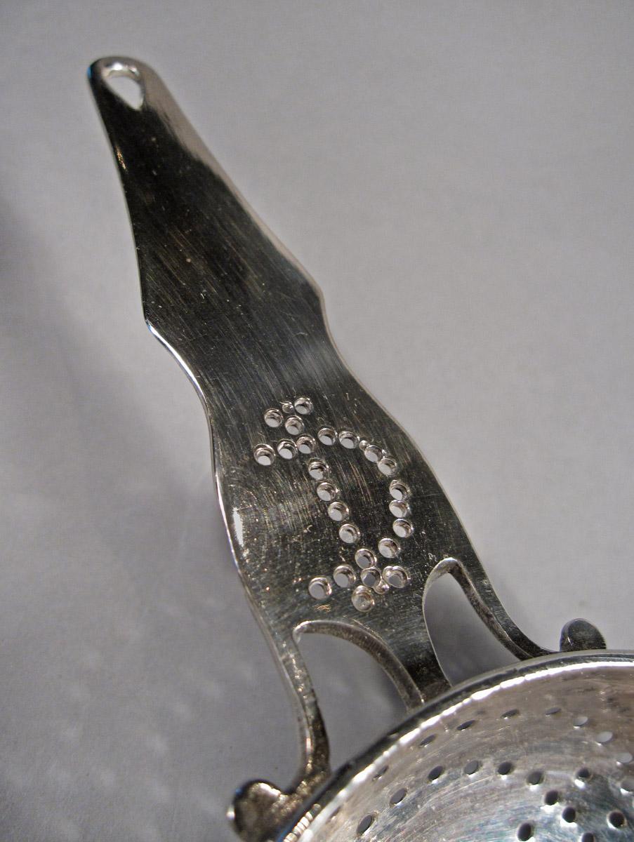 1957.0829 Strainer, detail 2