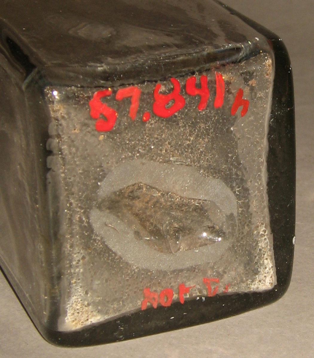 1957.0841 H Glass case bottle (underside)