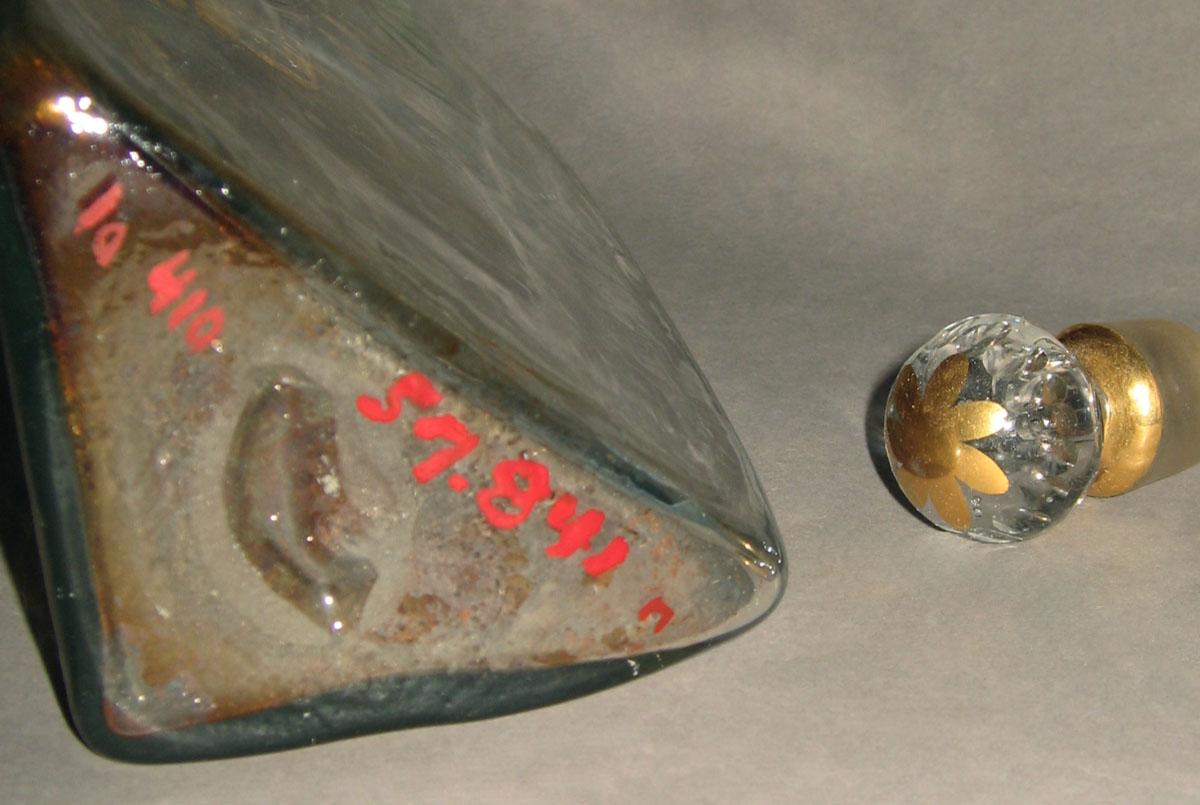 1957.0841 N, NN Glass case bottle and stopper (detail)