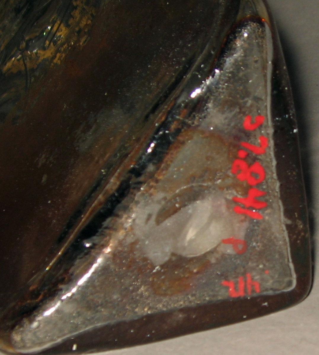 1957.0841 P Glass case bottle (underside)