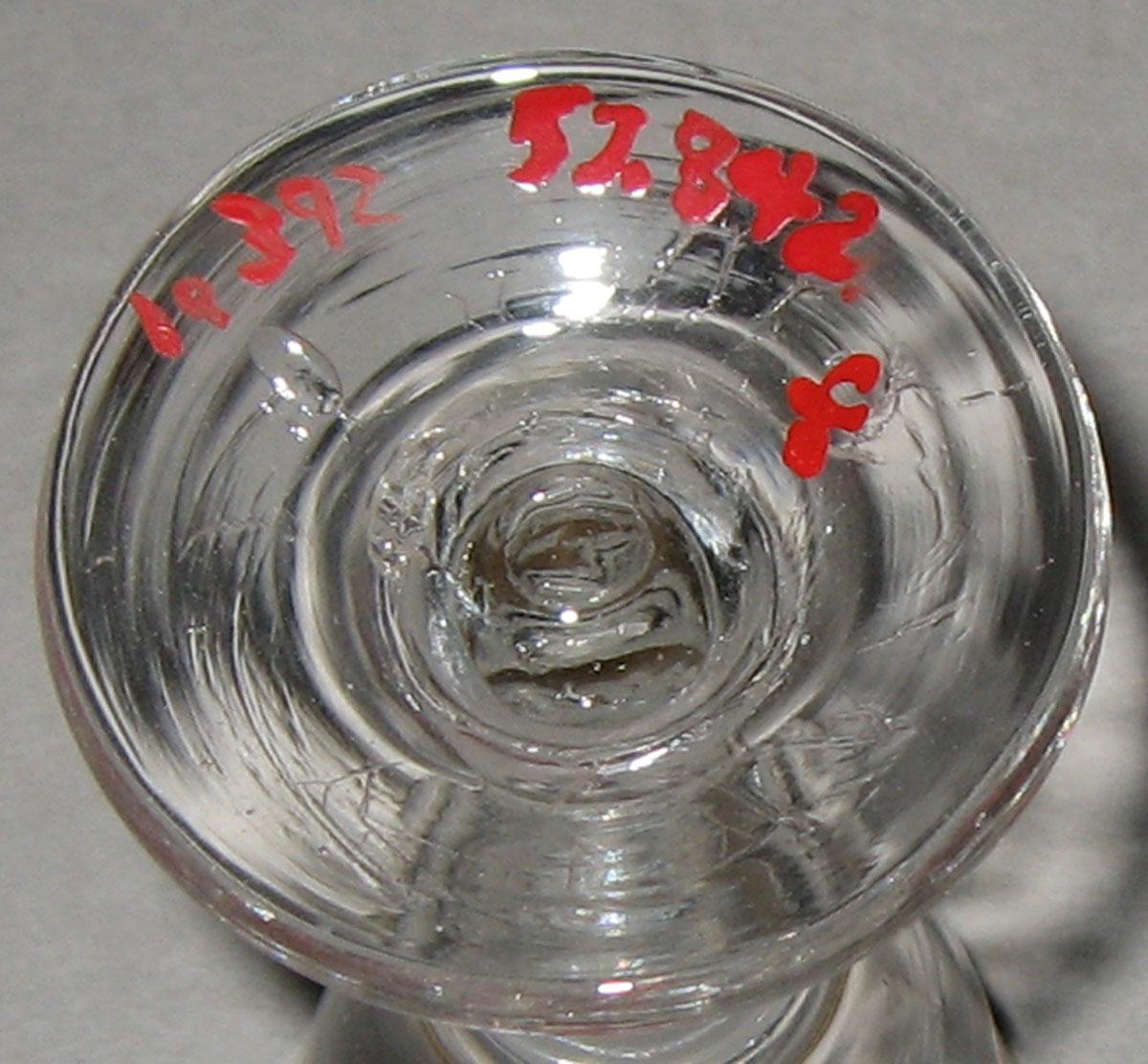 1957.0842 F Glass wineglass (underside)
