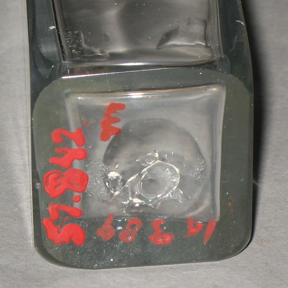 1957.0842 M Glass bottle (underside)