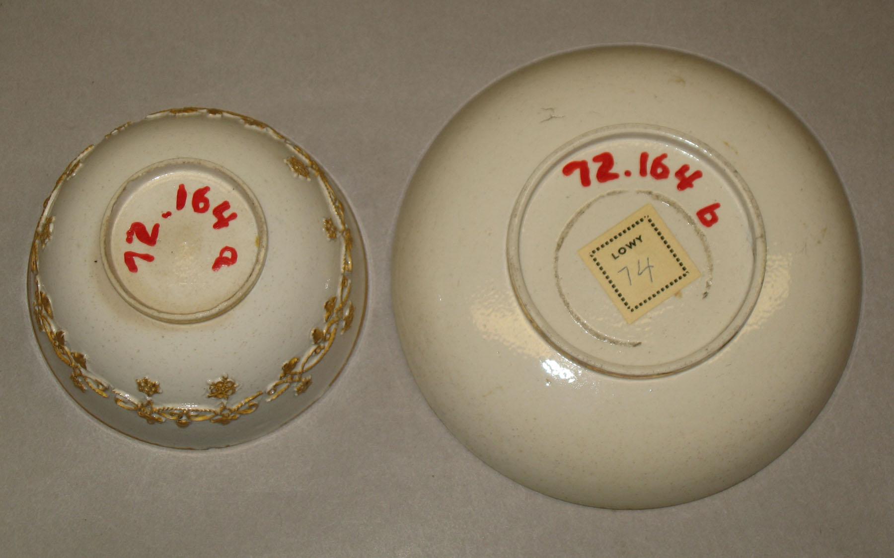 1972.0164 A, B Salt-glazed stoneware teabowl and saucer (bottom)
