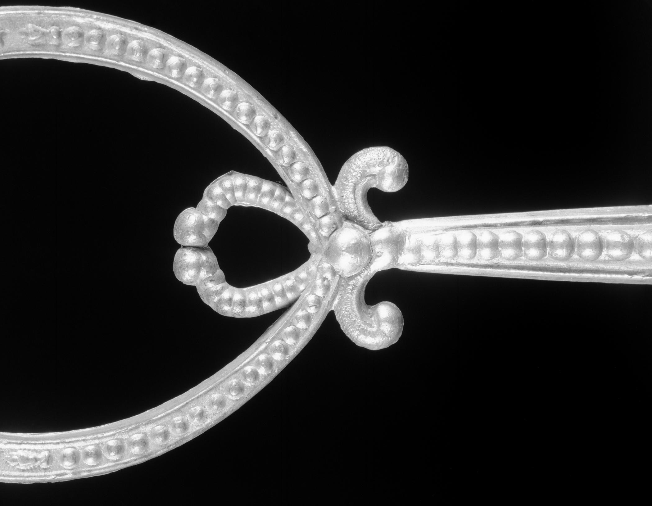 1972.0251Miniature pewter castor stand (detail)
