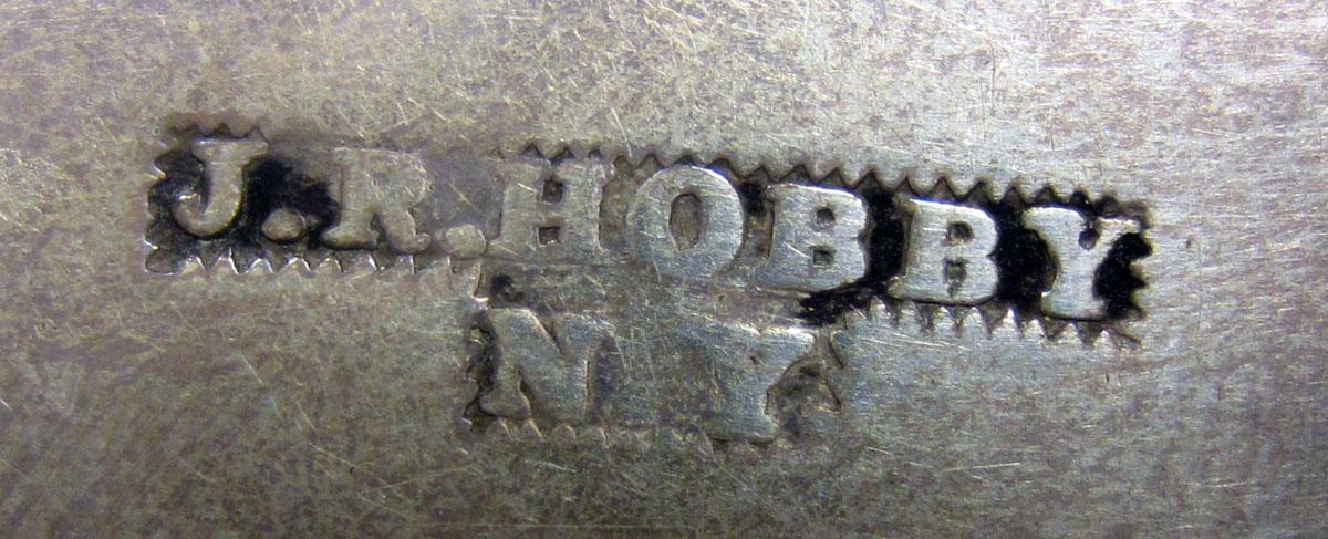 1972.0384 Teaspoon mark