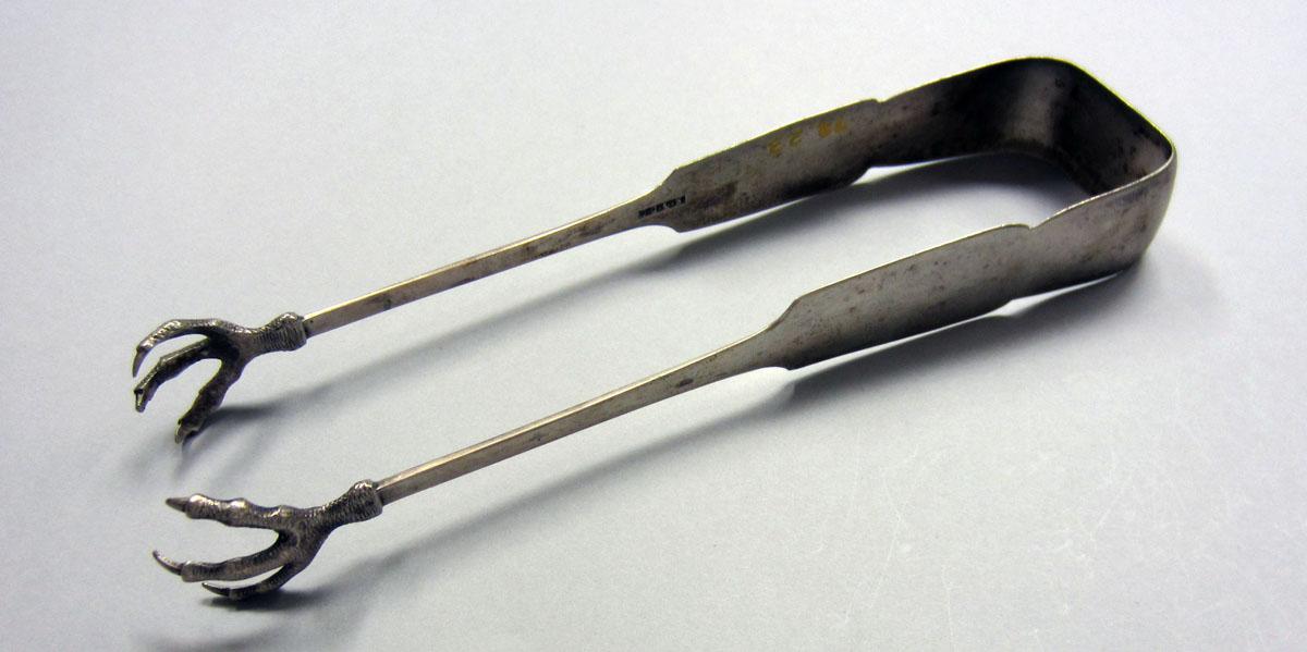 1973.0023 Sugar tongs view 1