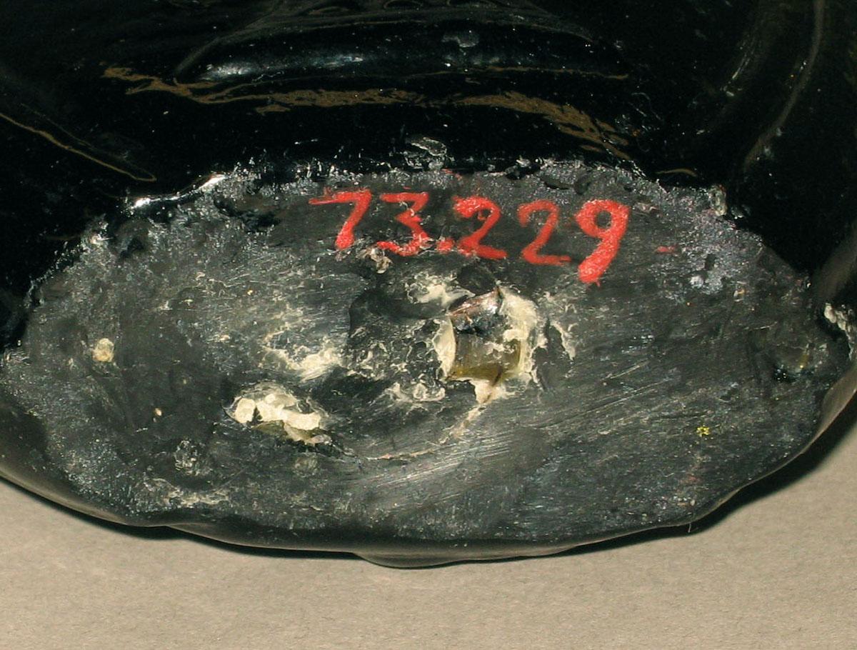 1973.0229 Glass flask (underside)