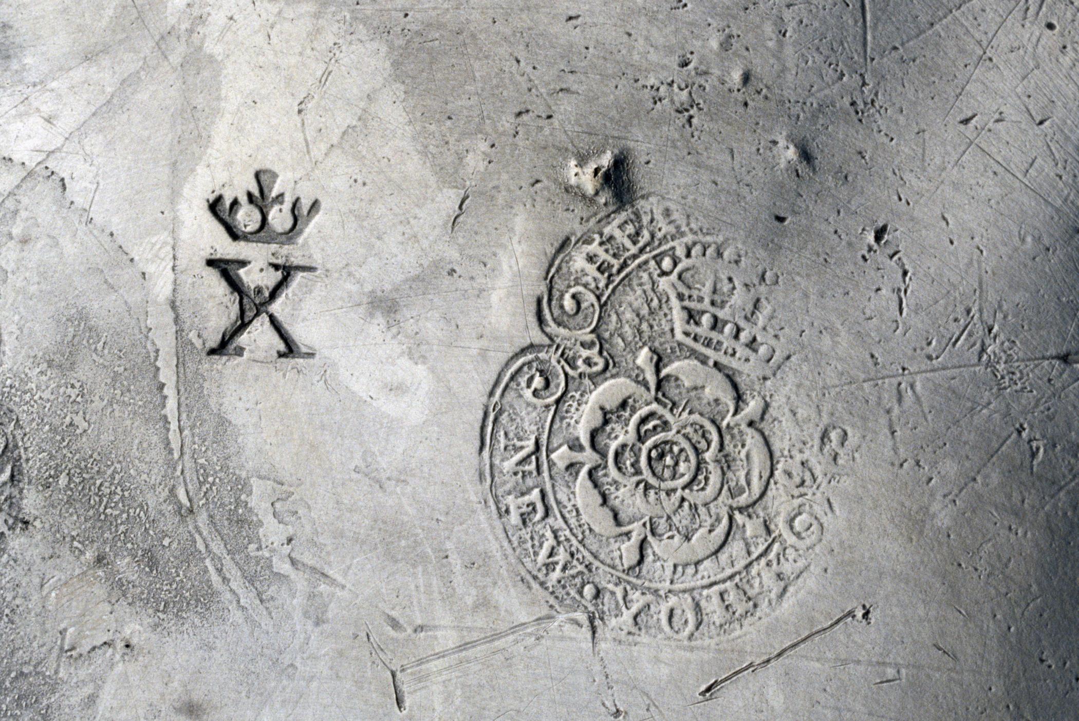 1973.0343 Pewter hot water plate (marks)