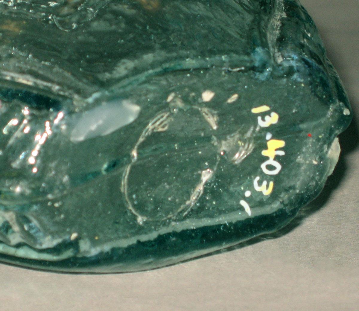 1973.0403.001 Glass flask (underside)