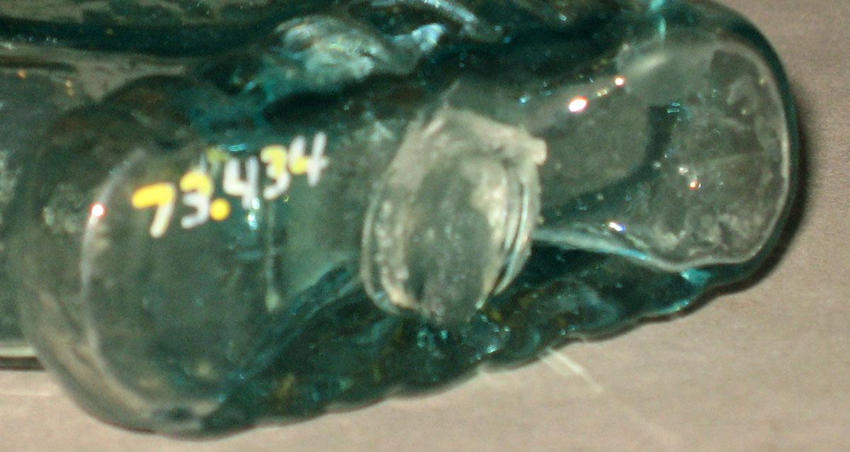 1973.0434 Glass bottle (underside)