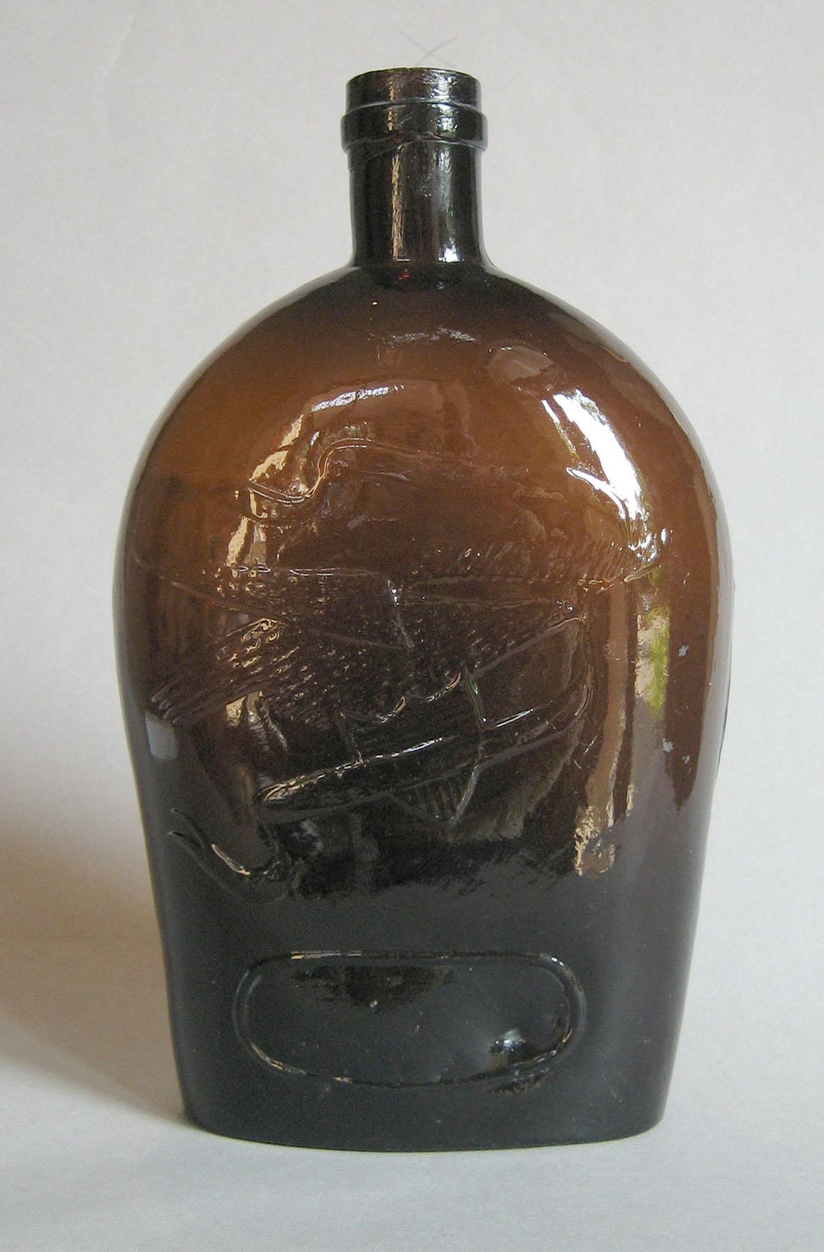 1973.0436.001 Glass flask side 1