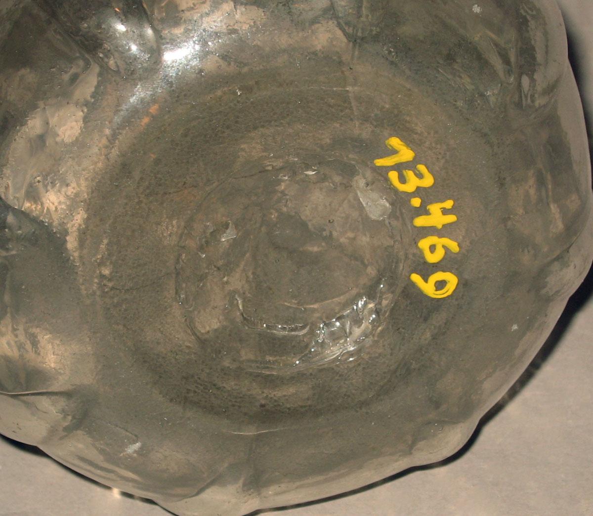 1973.0469 Glass cruet (underside)
