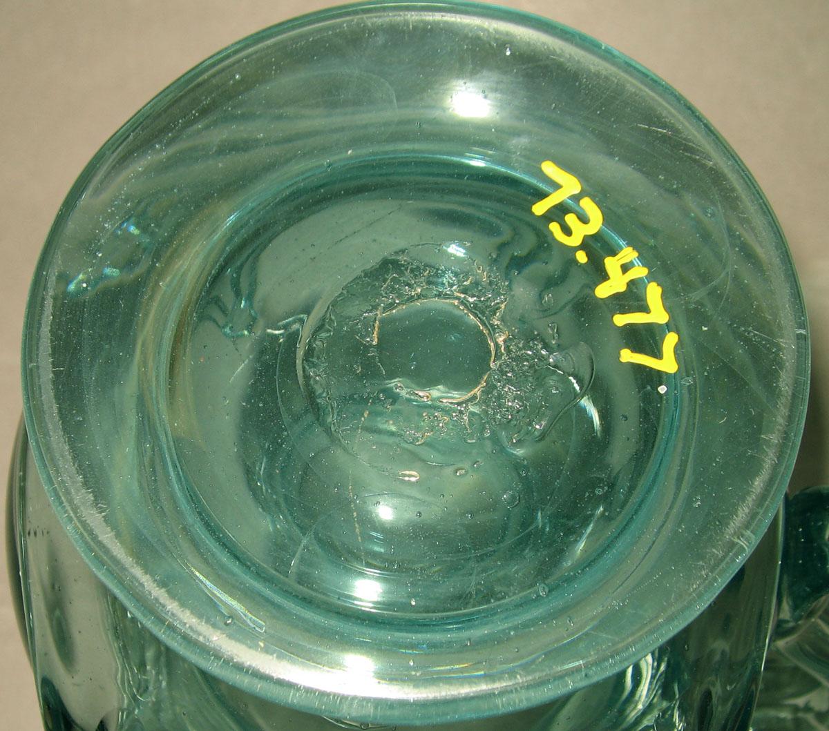 1973.0477 Glass jug (underside)