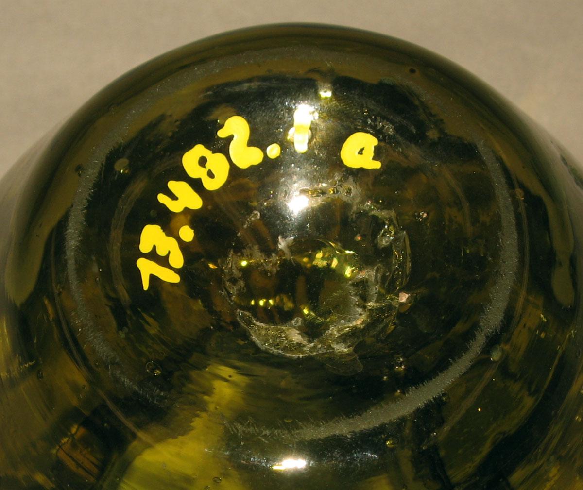 1973.0482.001 A Glass covered jar (underside)