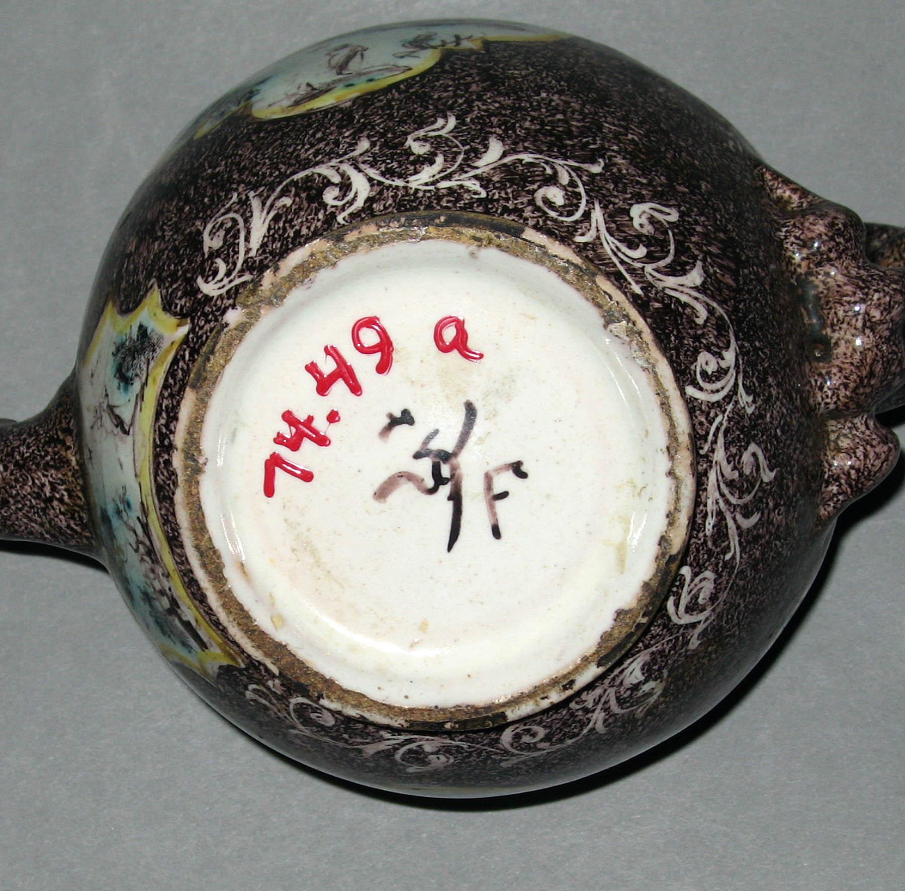 1974.0049 A Earthenware teapot (underside)