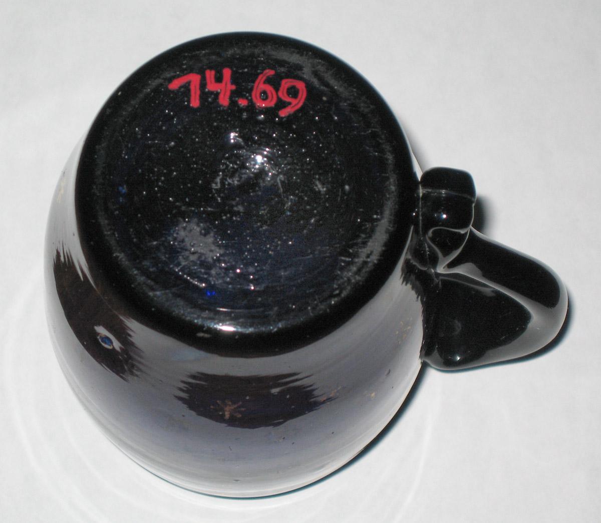 1974.0069 Blue glass mug (bottom)