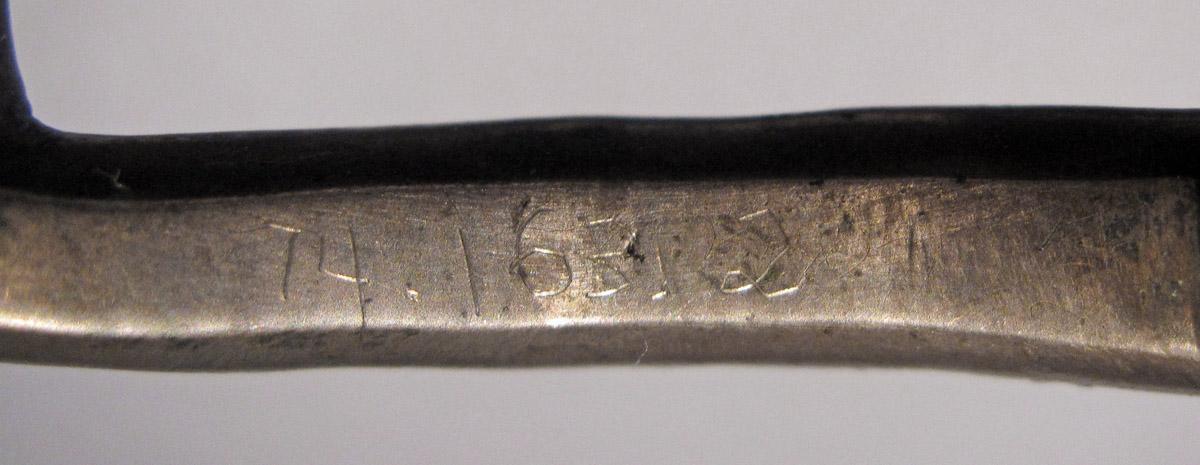 1974.0163.002 Buckle, inscription