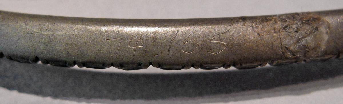 1974.0165 Cravat pin, inscription