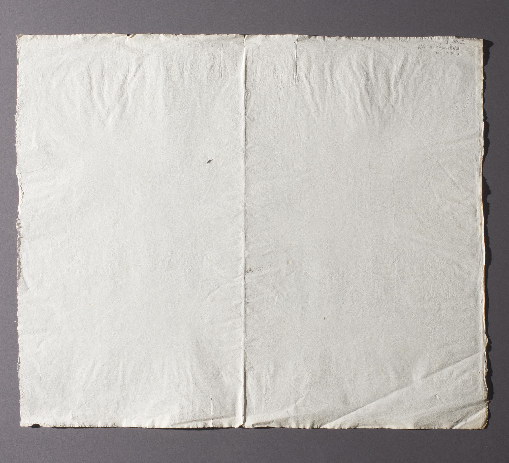 1974.0168.009 Sample paper, view 4, reverse, raking light