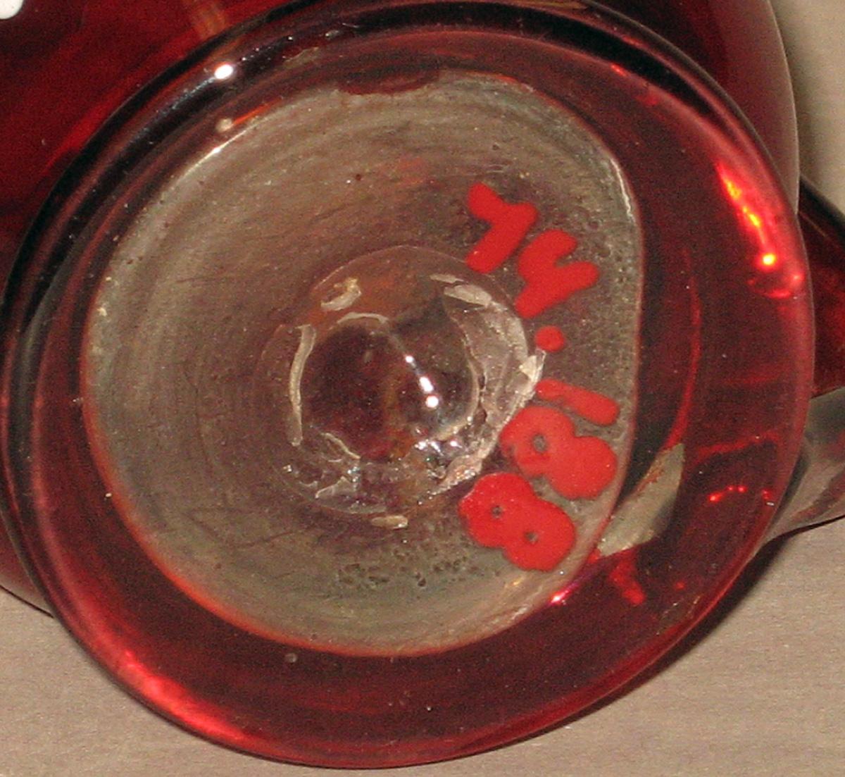 1974.0188 Glass mug (underside)