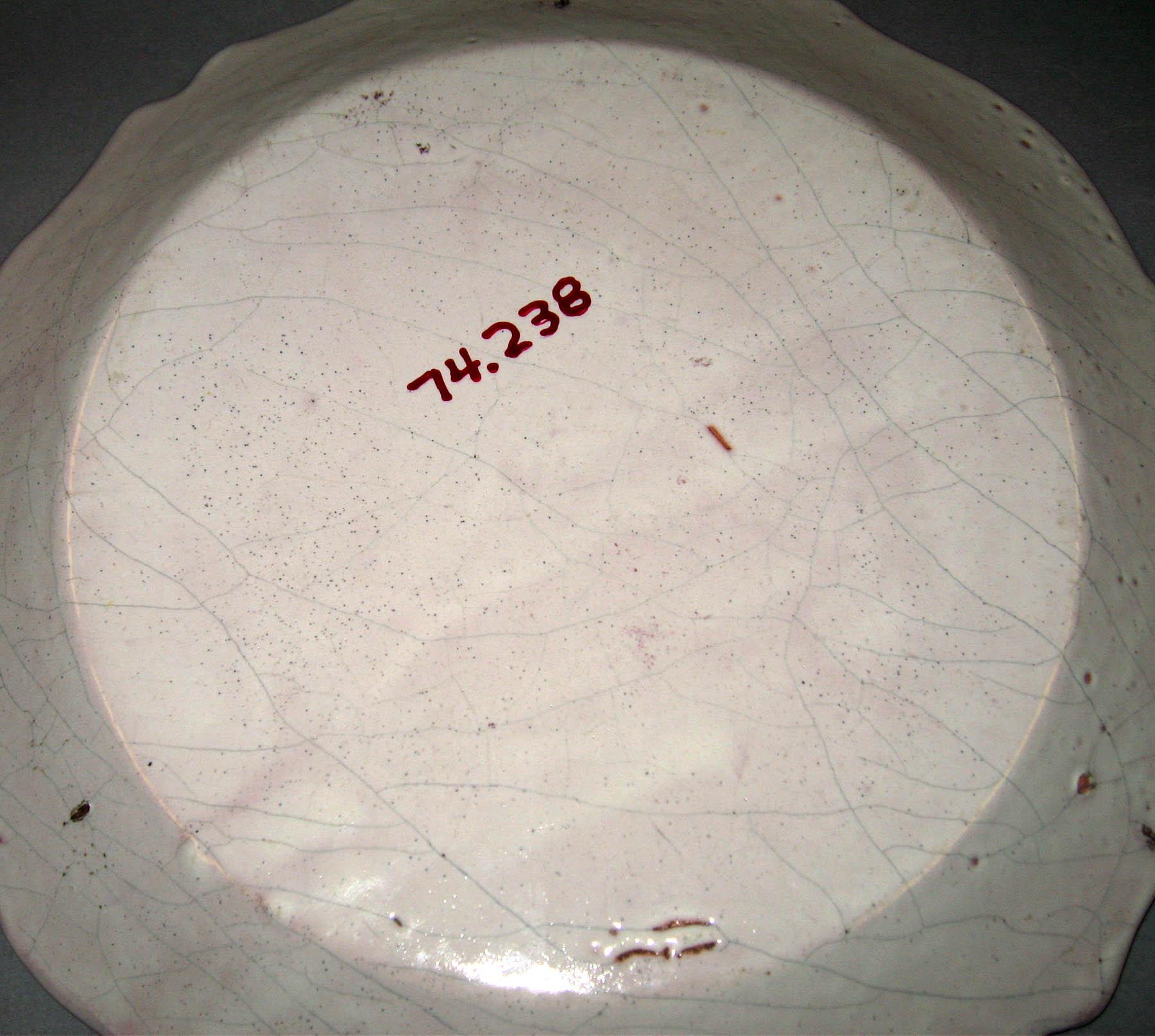 1974.0238 Tin-glazed earthenware plate (underside)