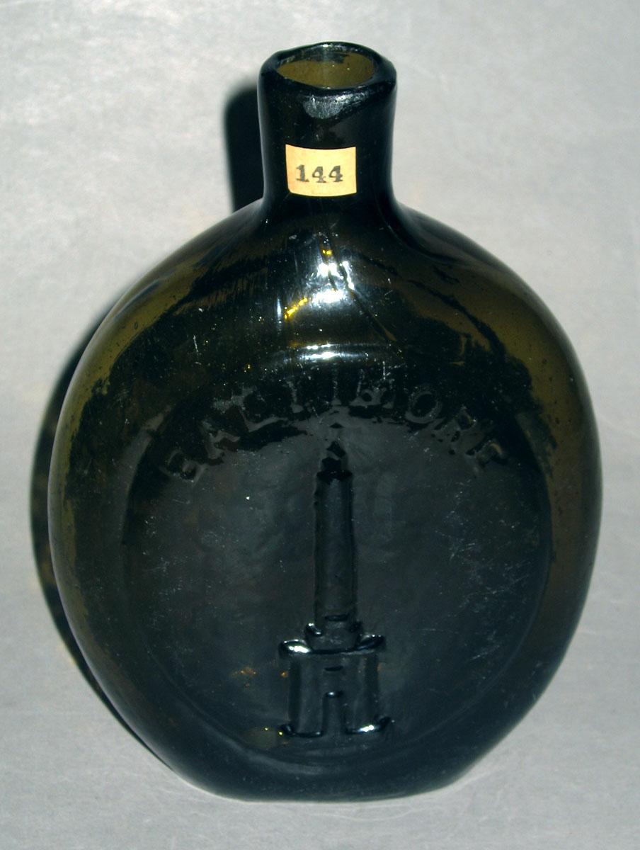1975.0193 Glass bottle (side 1)