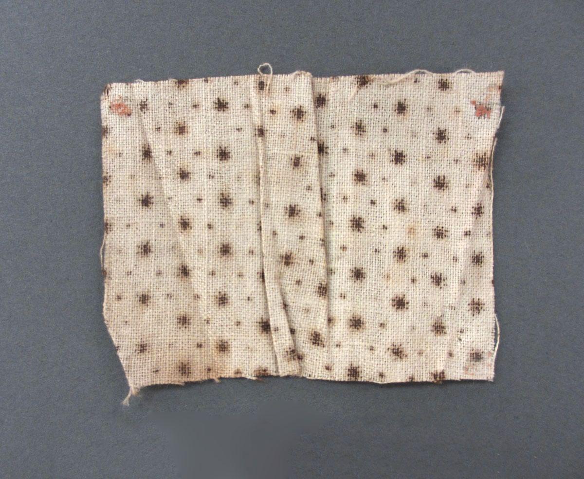 1975.0214.001 textile, printed, reverse