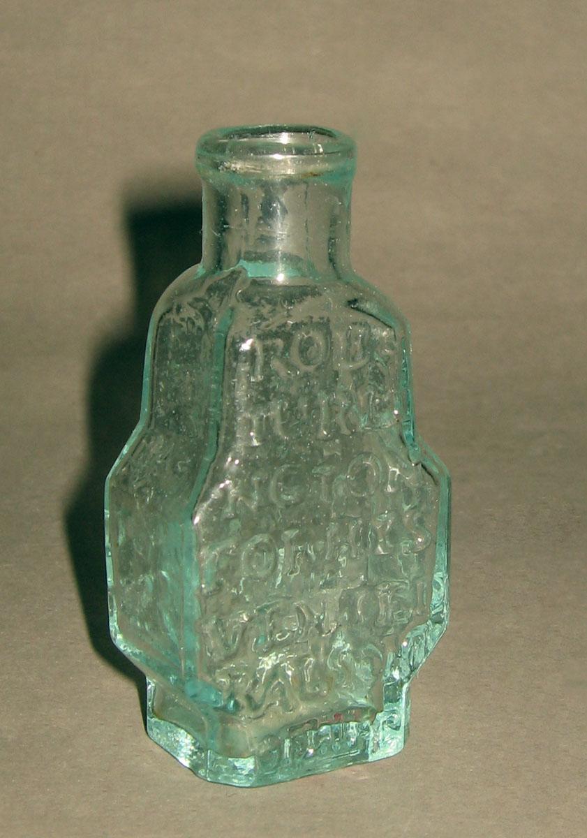 1975.0224 Glass bottle (opposite side)