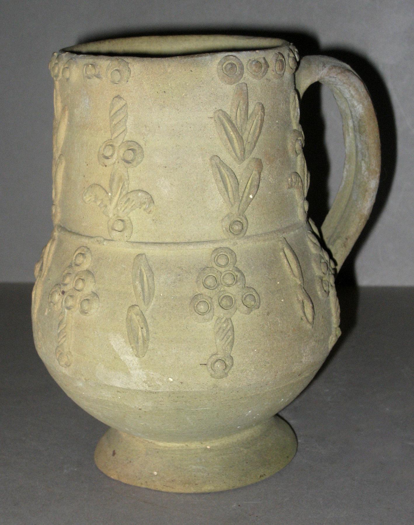 1975.0229 Unglazed stoneware jug or mug