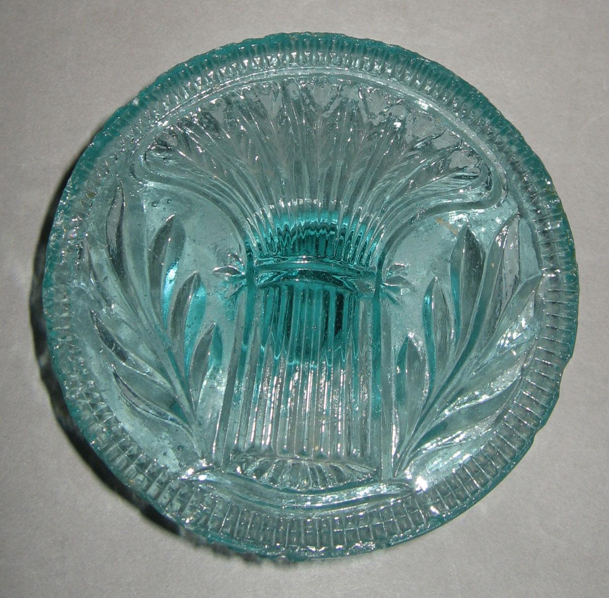 1976.0125 Aqua-tinted glass butter press