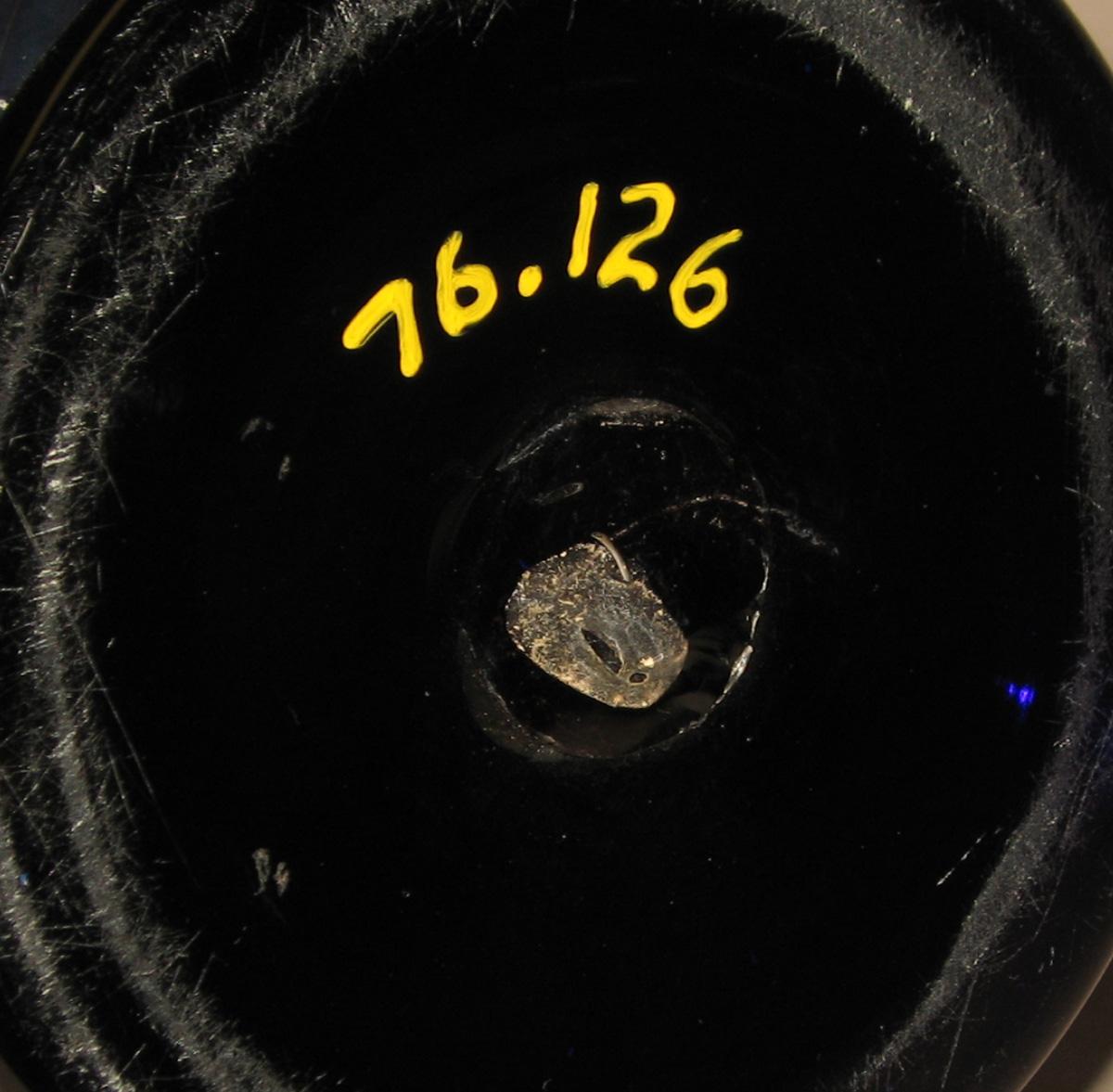 1976.0126 Blue glass jug (underside)