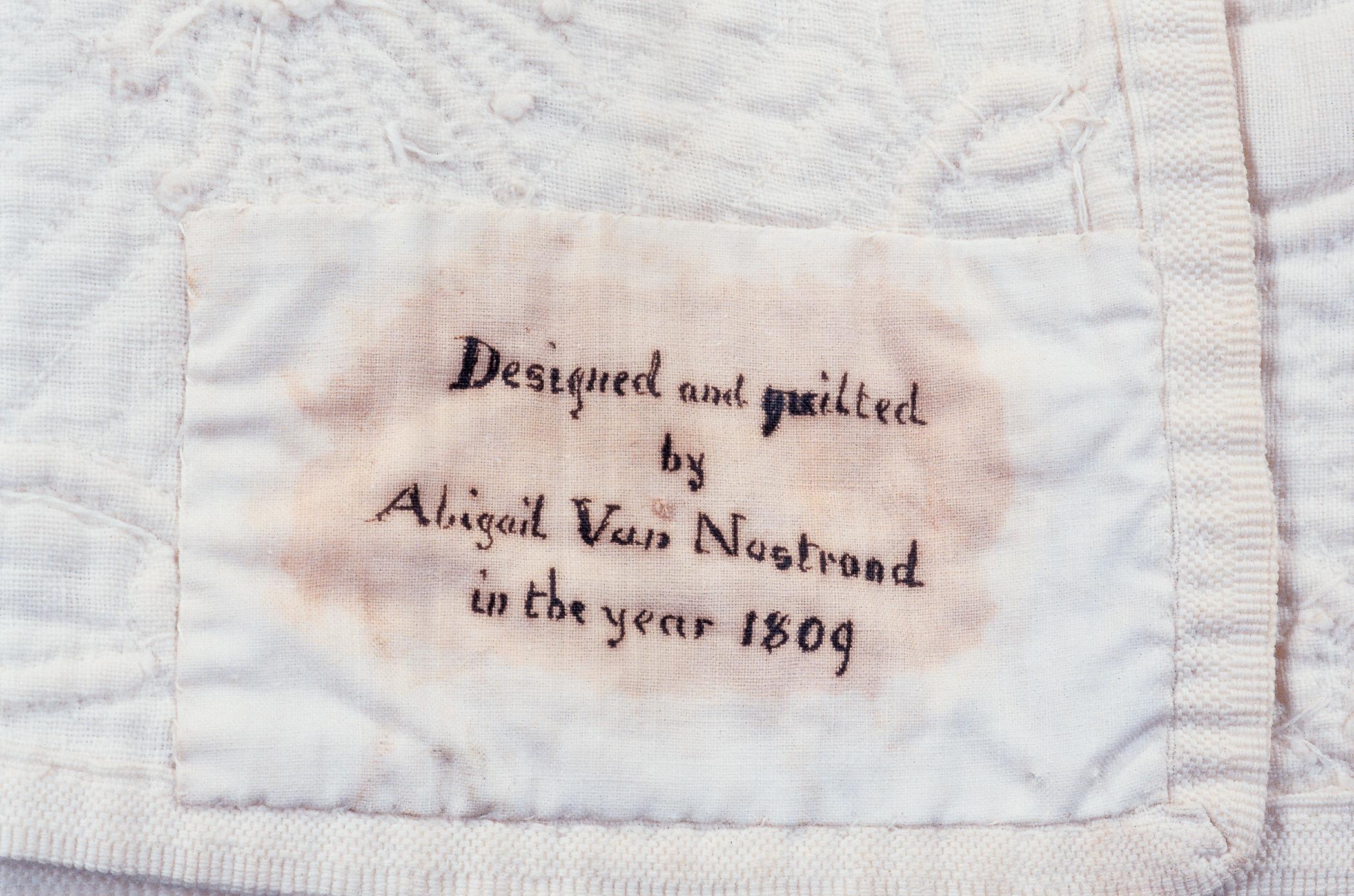1976.0301 Quilt, whitework signature detail