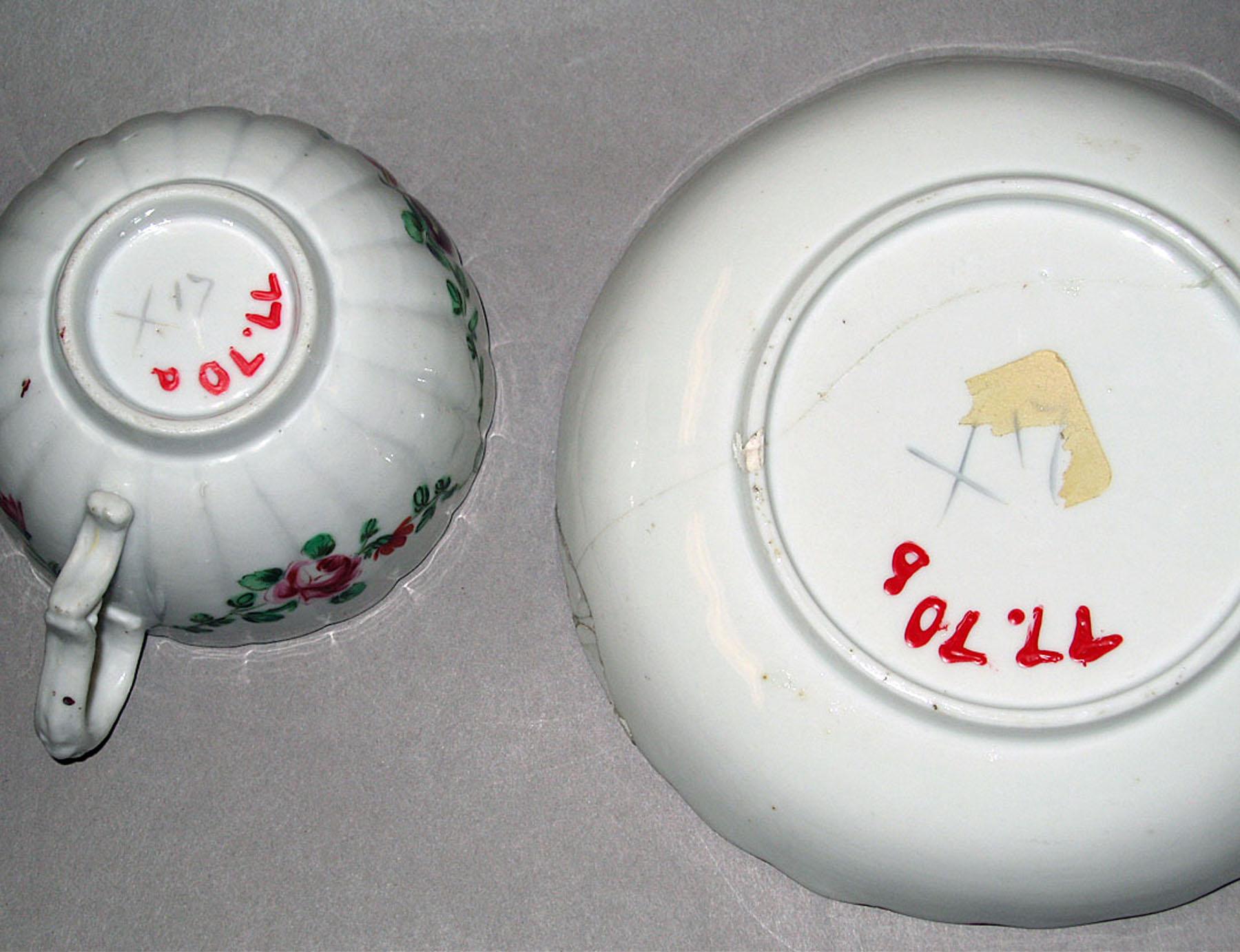 1977.0070 A, B Bristol hard-paste porcelain teacup and saucer (undersides)