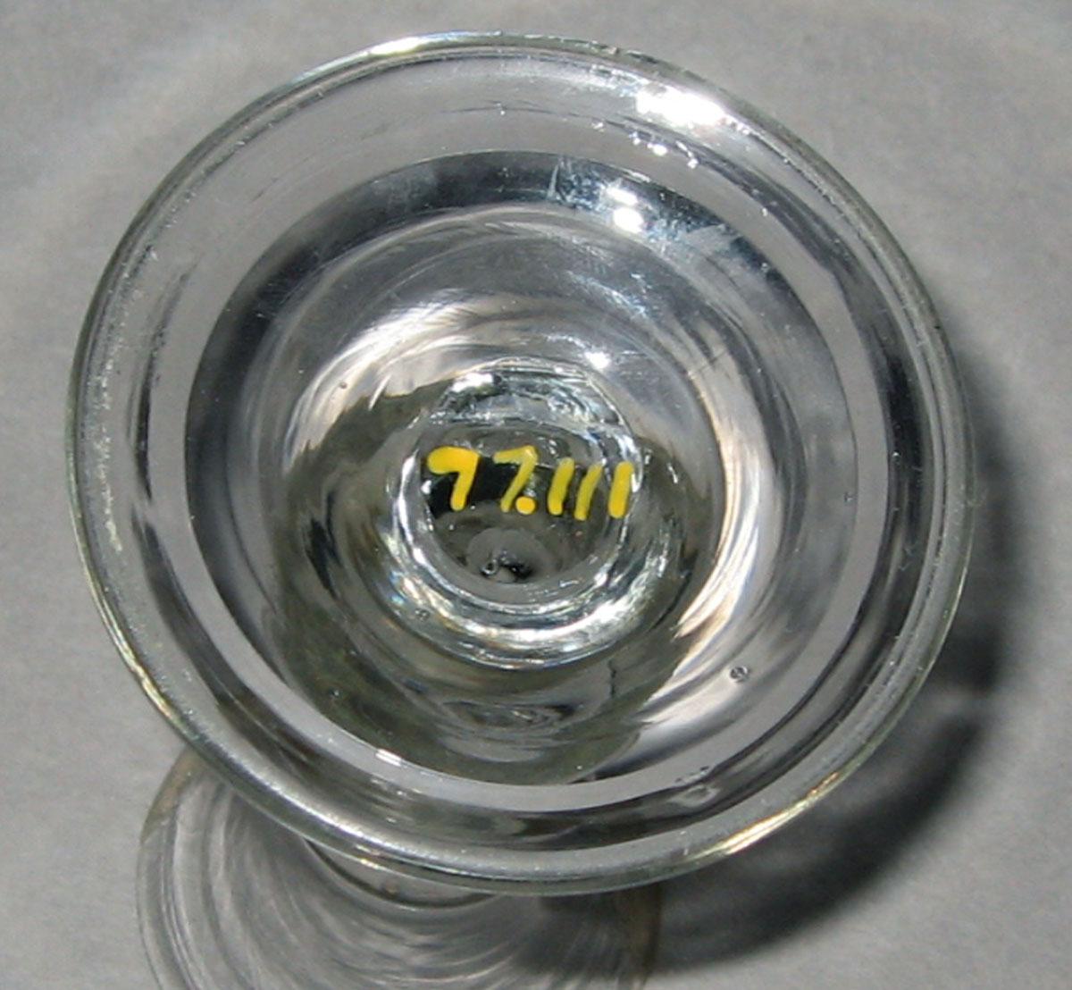 1977.0111 Colorless glass wineglass or dram glass (underside)